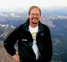 Kirk on top of Gray'
s Peak, a 14,000 foot peak in Colorado